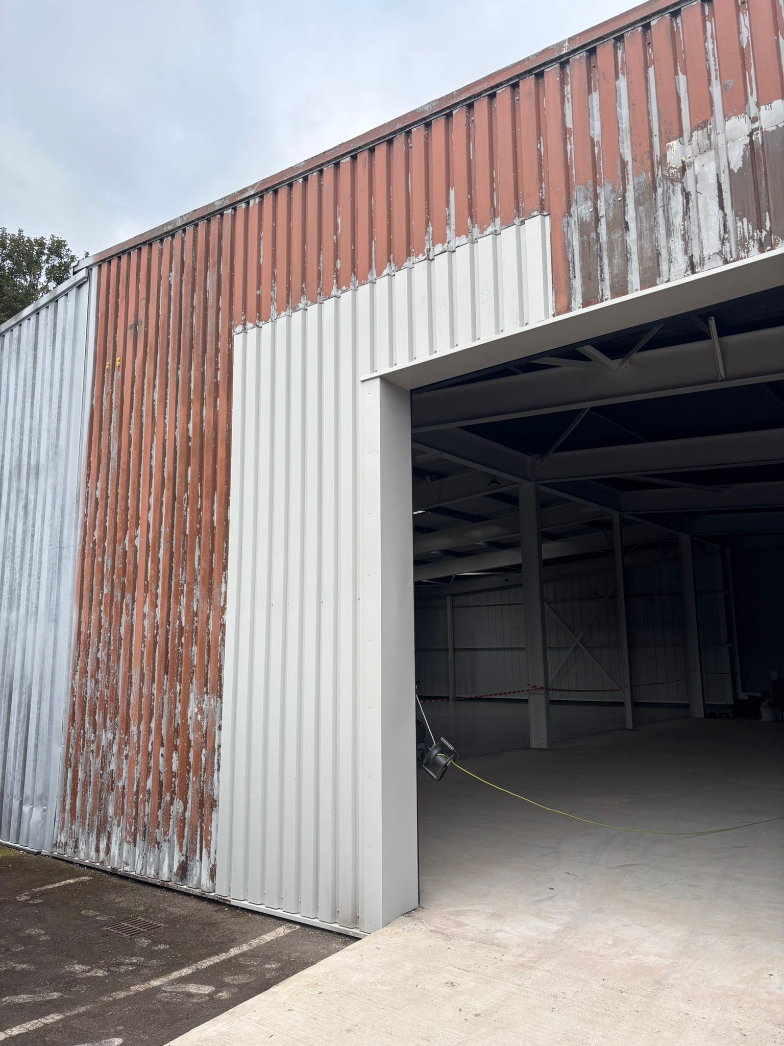 Close-up of deteriorated cladding panels