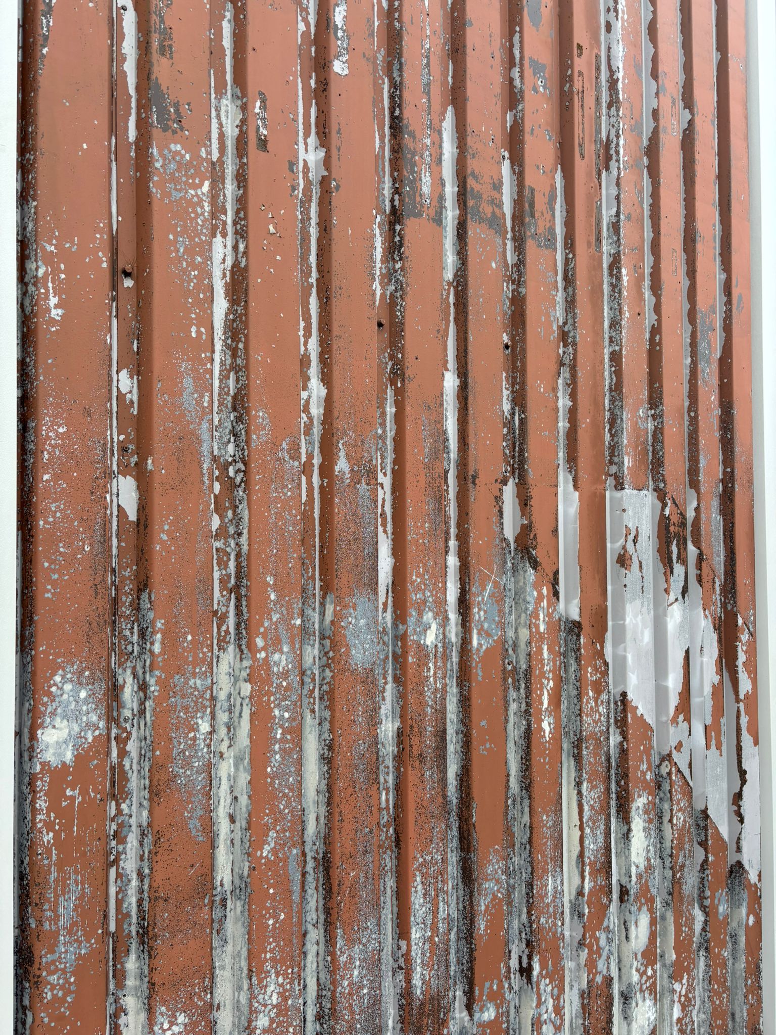 Detailed view of peeling paint and rust