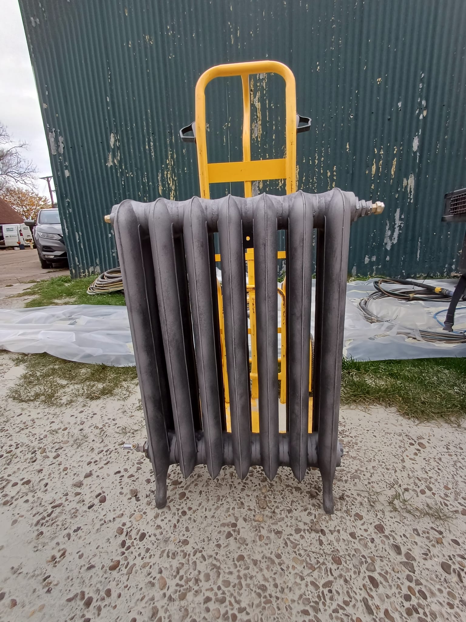 Fully restored cast iron radiator with clean bare metal finish