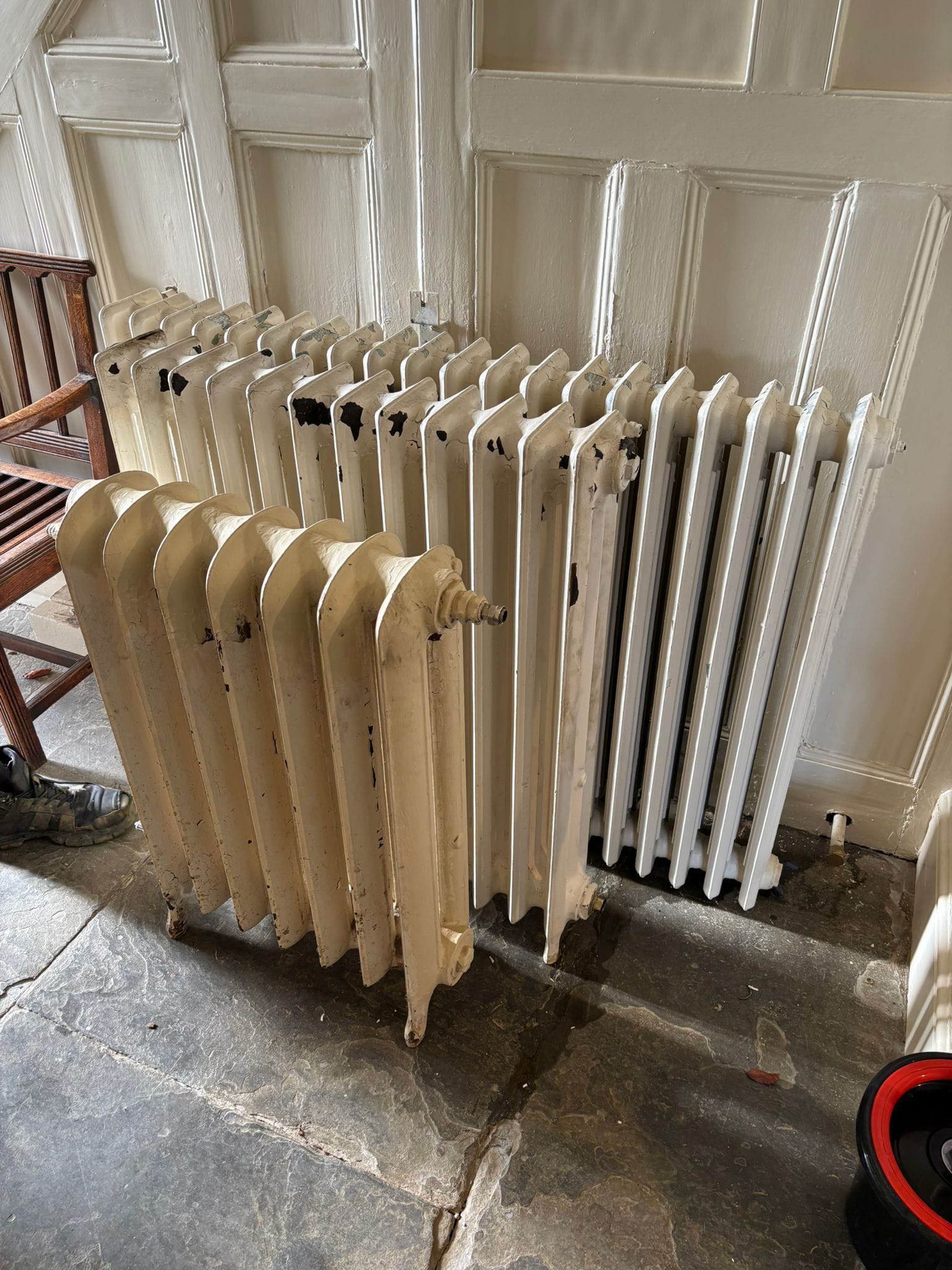 Victorian cast iron radiator with decades of paint buildup