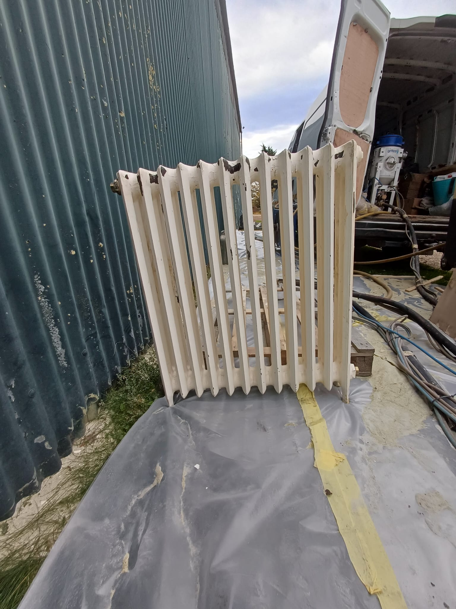 Heritage radiator with paint buildup on decorative features